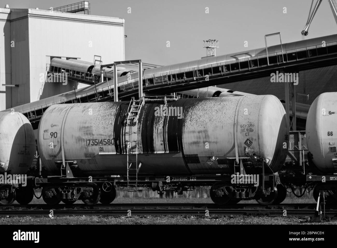 Oil train wagons on oil refinery Stock Photo - Alamy