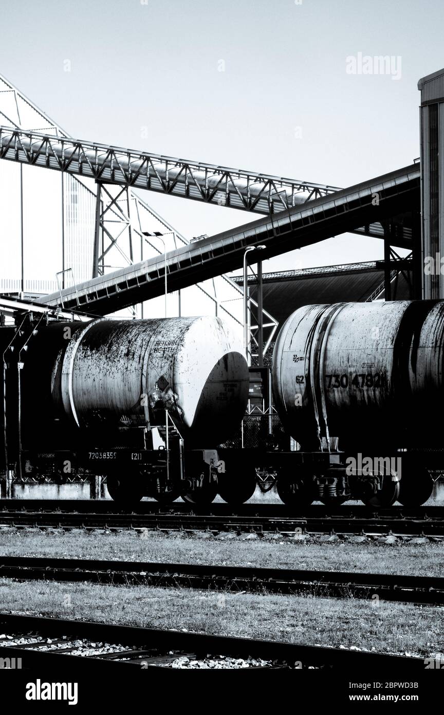 Oil train wagons on oil refinery Stock Photo - Alamy
