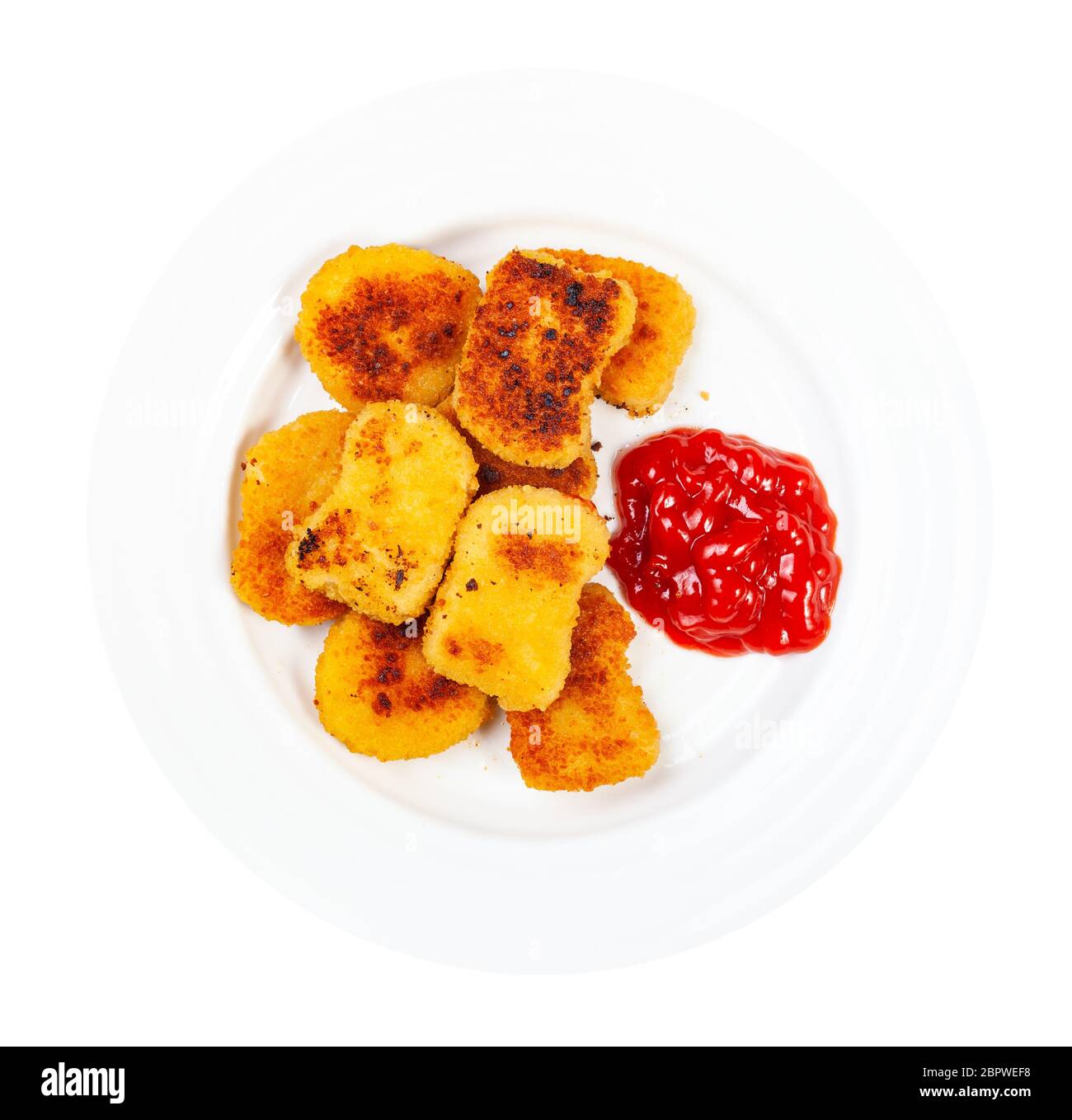 top view of many fried chicken nuggets with tomato ketchup on white plate isolated on white background Stock Photo