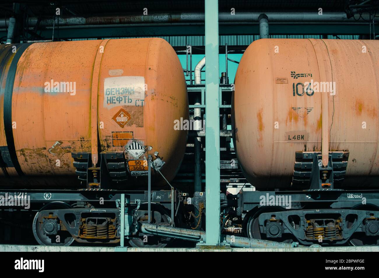 Oil train wagons on oil refinery Stock Photo - Alamy