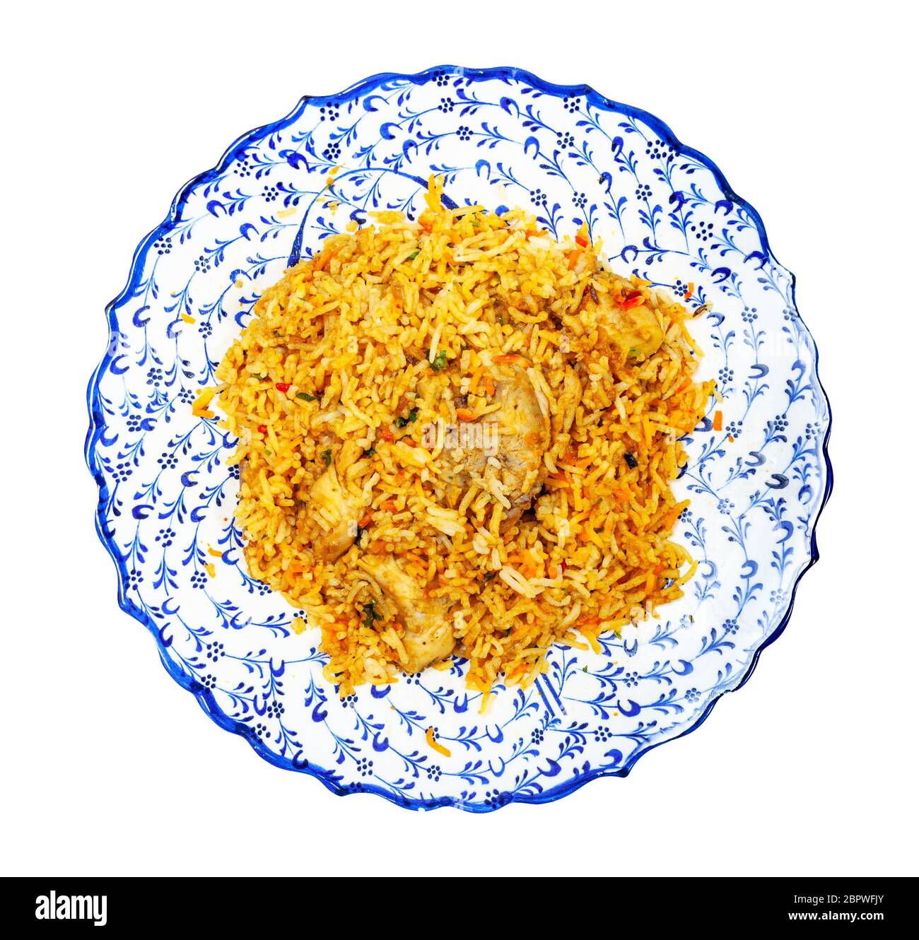 Indian cuisine - top view of portion of Chicken biryani (mixed rice dish  made with Indian spices, curry, rice, chicken meat, vegetables) on muslim  orn Stock Photo - Alamy