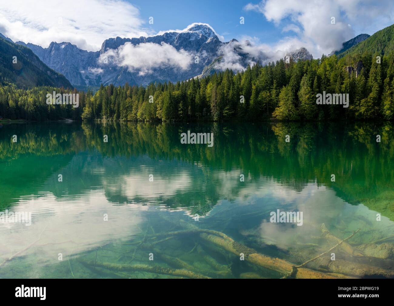 beautiful morning at Lake Laghi di Fusine in the Julian Alps in Italy ...