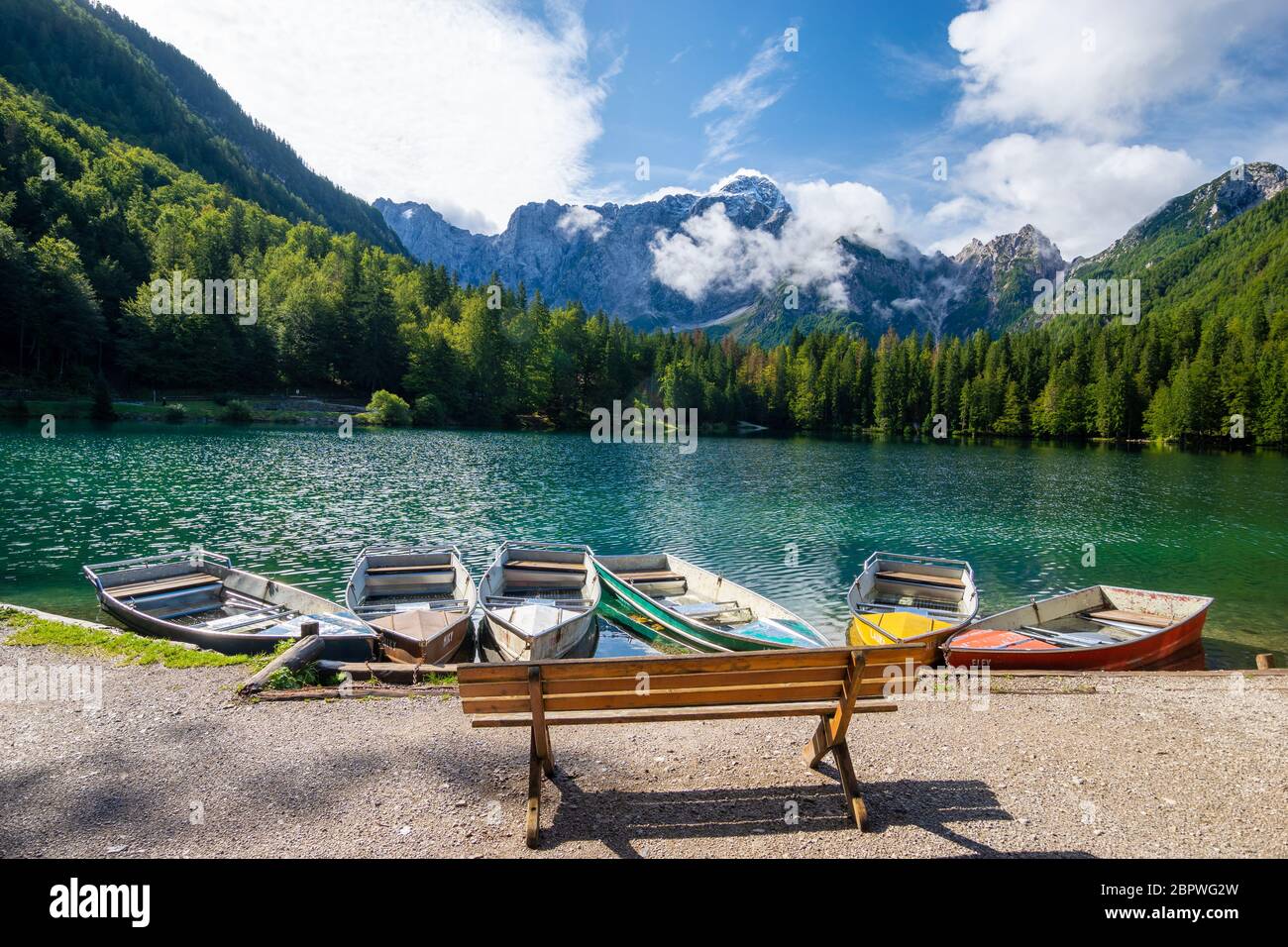 beautiful morning at Lake Laghi di Fusine in the Julian Alps in Italy ...