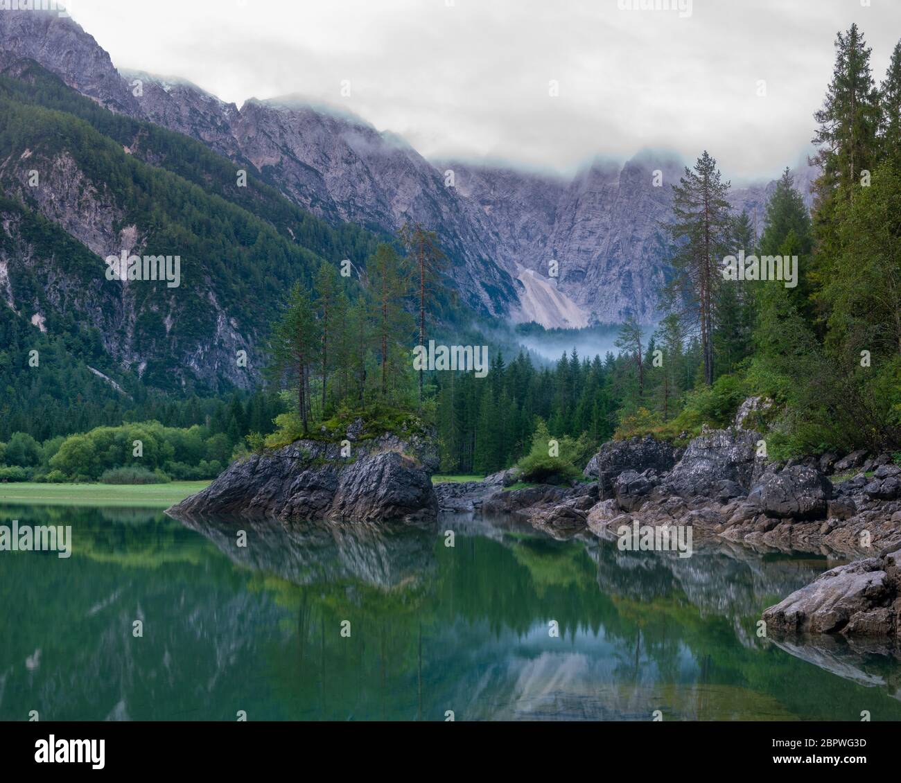 beautiful morning at Lake Laghi di Fusine in the Julian Alps in Italy ...