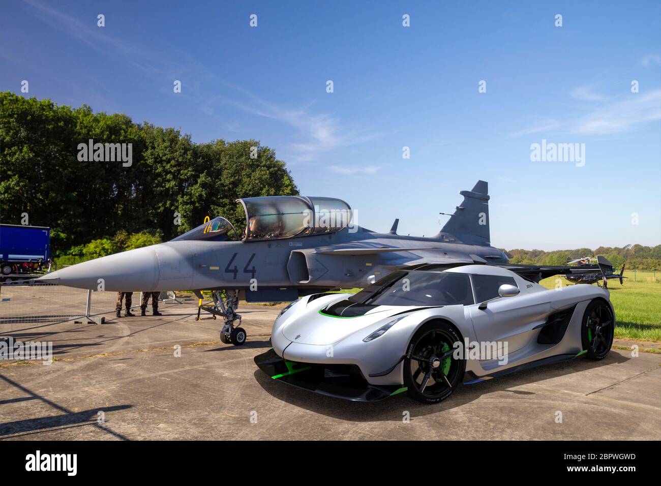 Koenigsegg Jesko, hyper car from Sweden standing next to the Saab JAS 39  Gripen combat aircraft, also from Sweden-artistic vision, 3d illustration  Stock Photo - Alamy