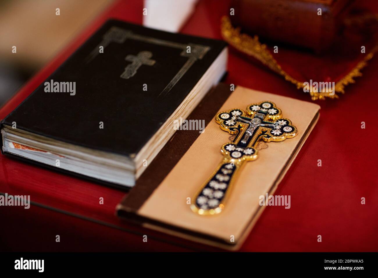 religious items, bible and gold cross prepared for a ceremony, inside a