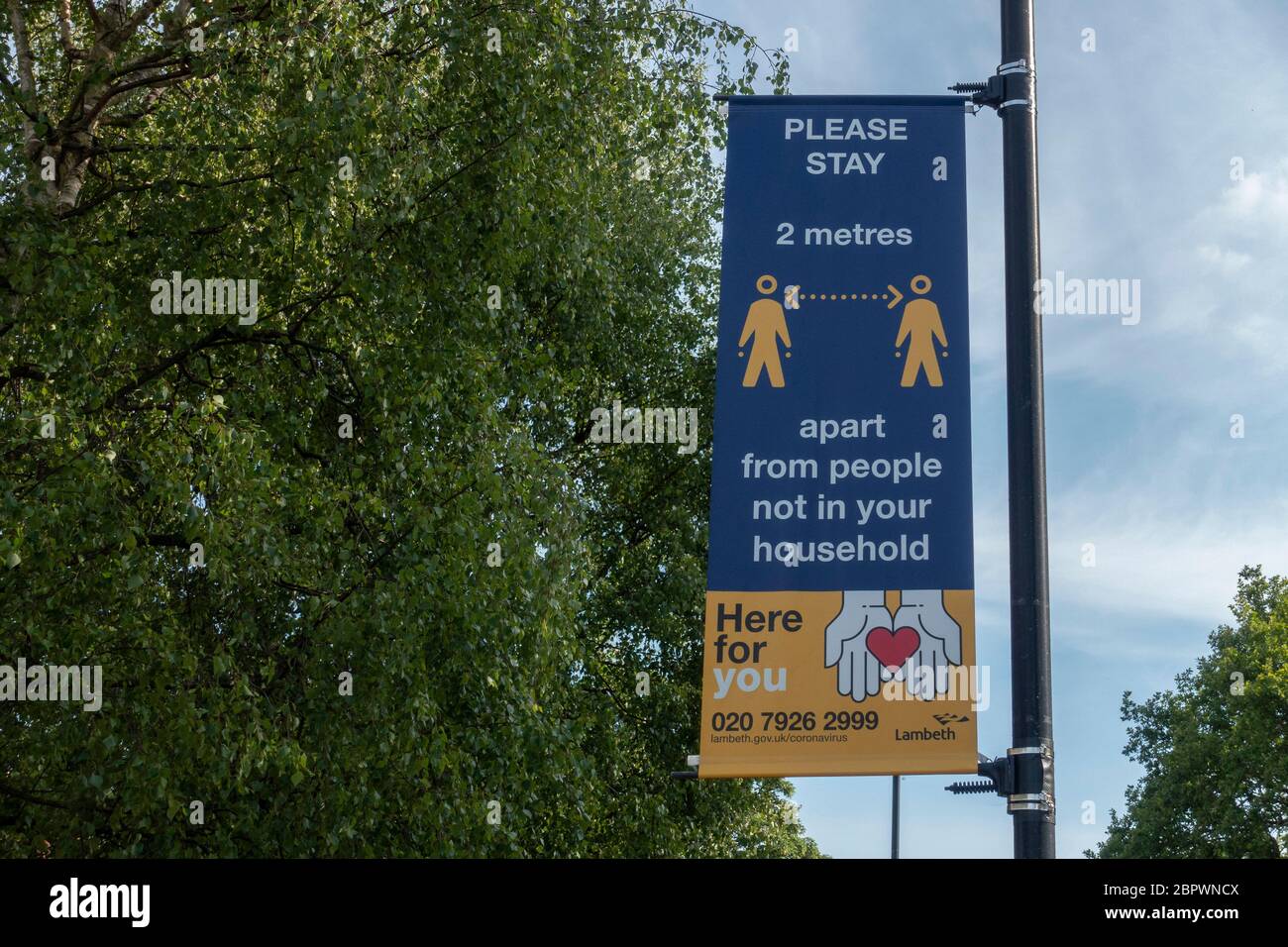 West Norwood, UK. 15th May, 2020. A social distancing advice sign hanging from a lamppost in West Norwood in South London. photo by Sam Mellish Stock Photo