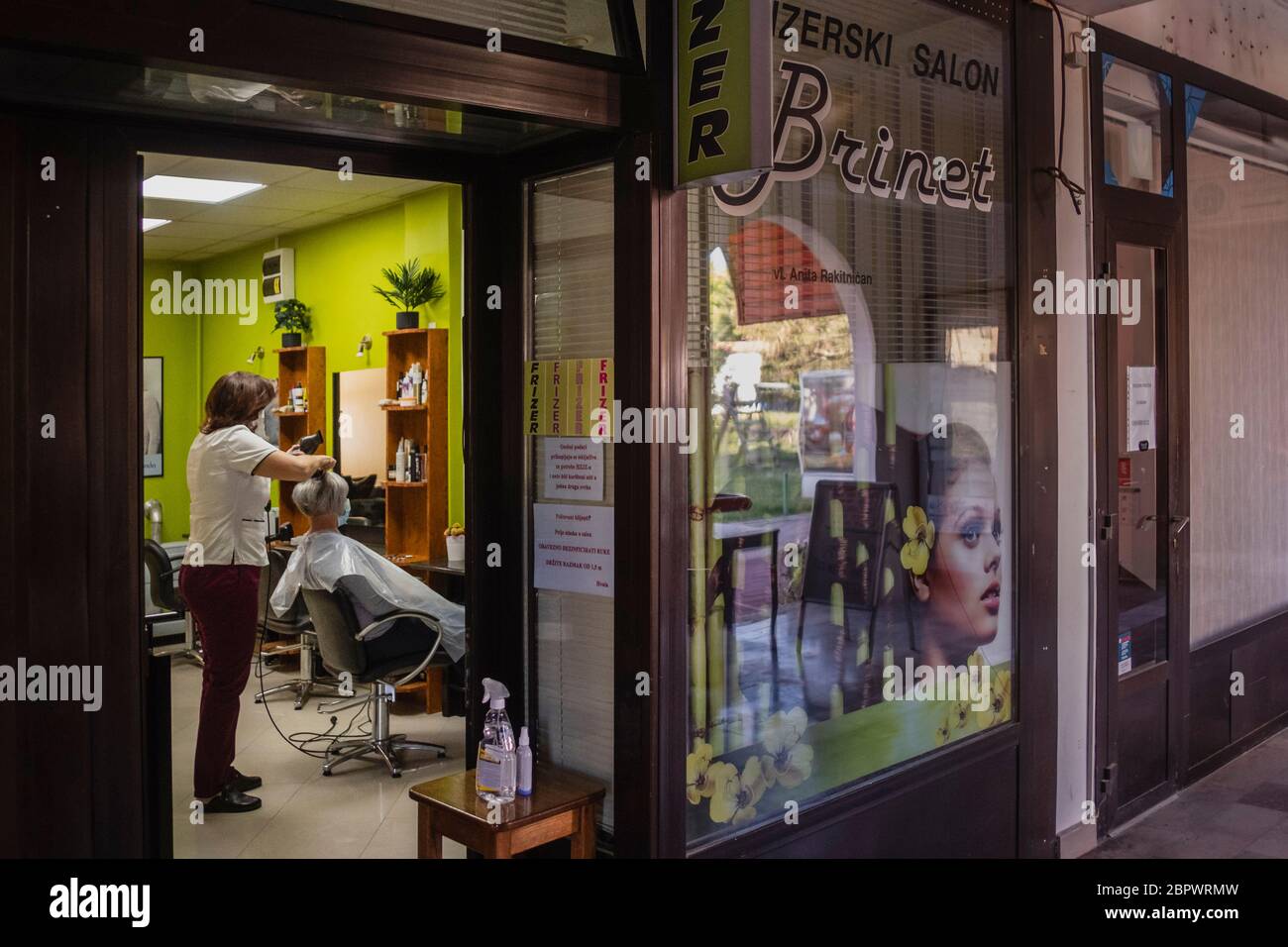 It is the first day back to work in Croatia for hair salon's and barber shops during the Covid19 pandemic. Only one person is allowed in to the Salon per appointment, and one barber or hairdresser. Croatia. Stock Photo