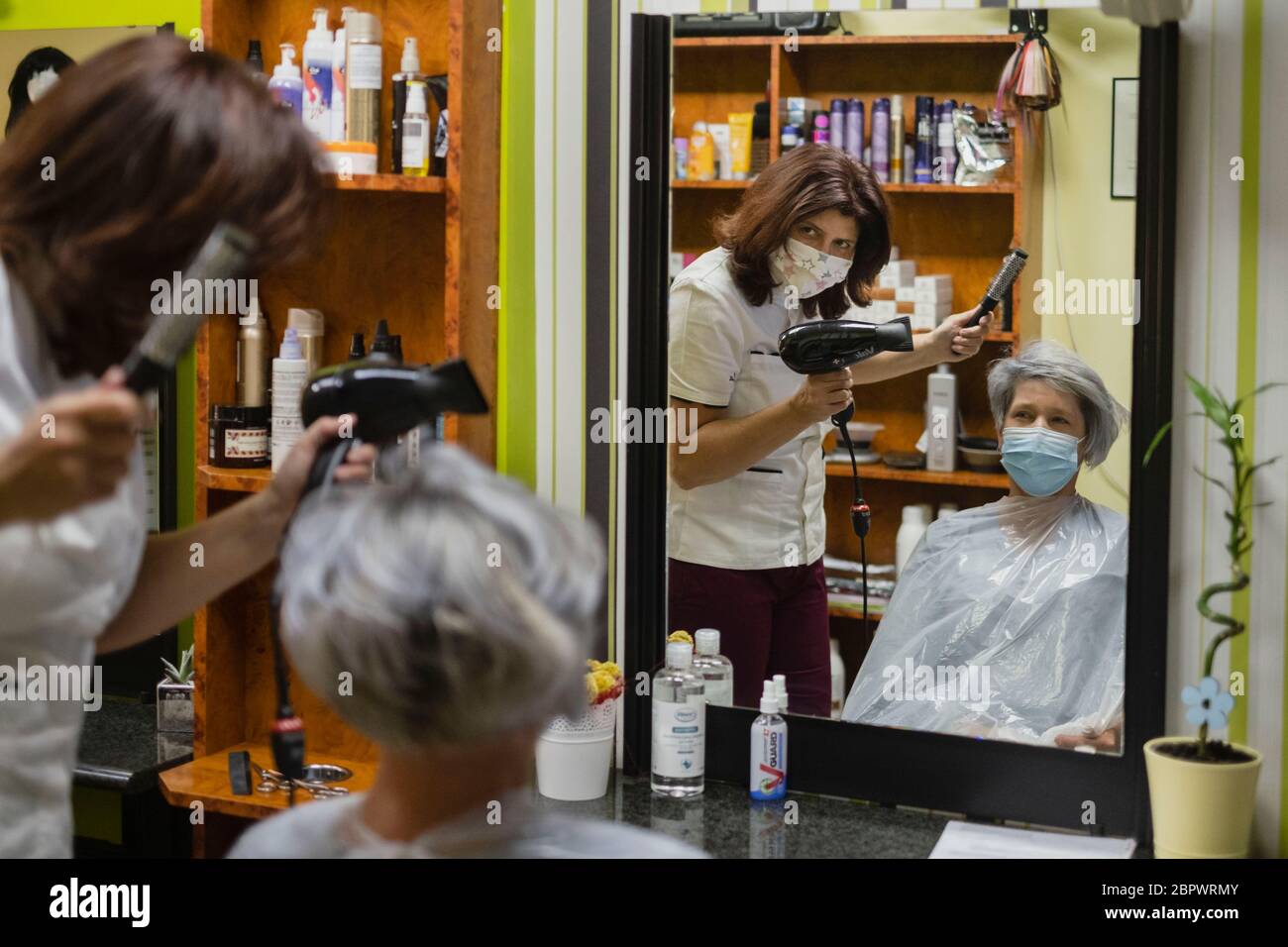 It is the first day back to work in Croatia for hair salons and barber shops during the Covid19 pandemic. Only one person is allowed in to the Salon per appointment, and one barber or hairdresser. Croatia. Stock Photo