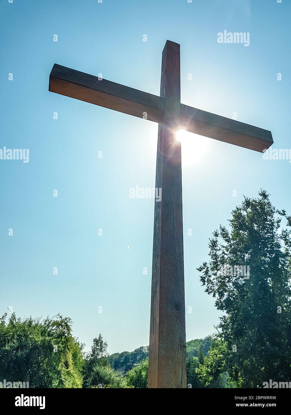 Huge Wooden Orthodox Eight Pointed Cross Against The Sky After The Dawn