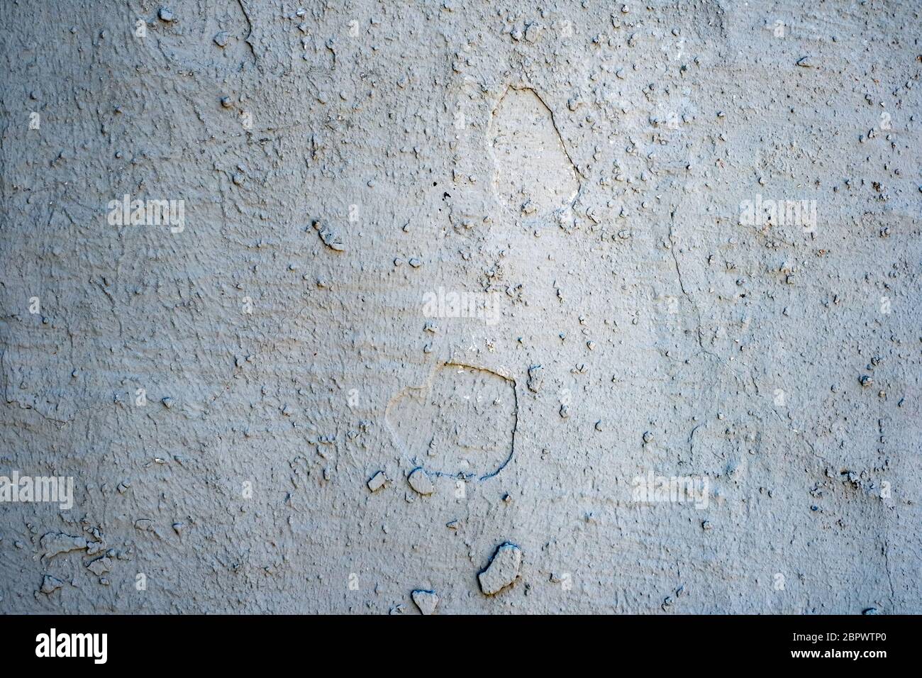 wall with dry and cracked blue paint Stock Photo