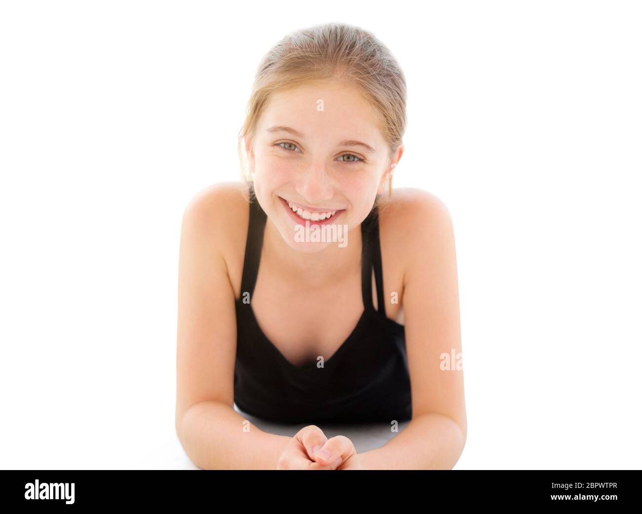 Cute teenager girl lying on a floor Stock Photo - Alamy