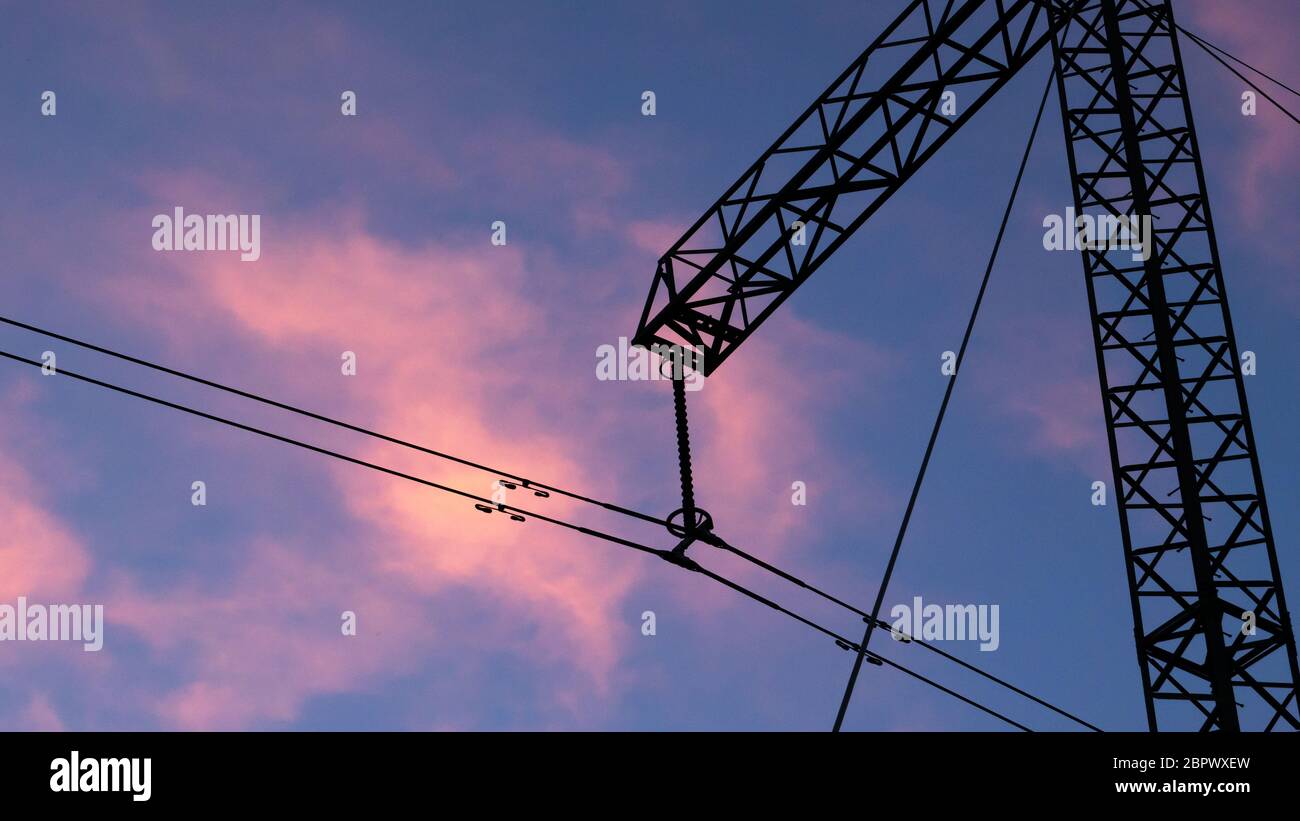 Silhouette of high voltage electric tower at beautiful sunset with ...