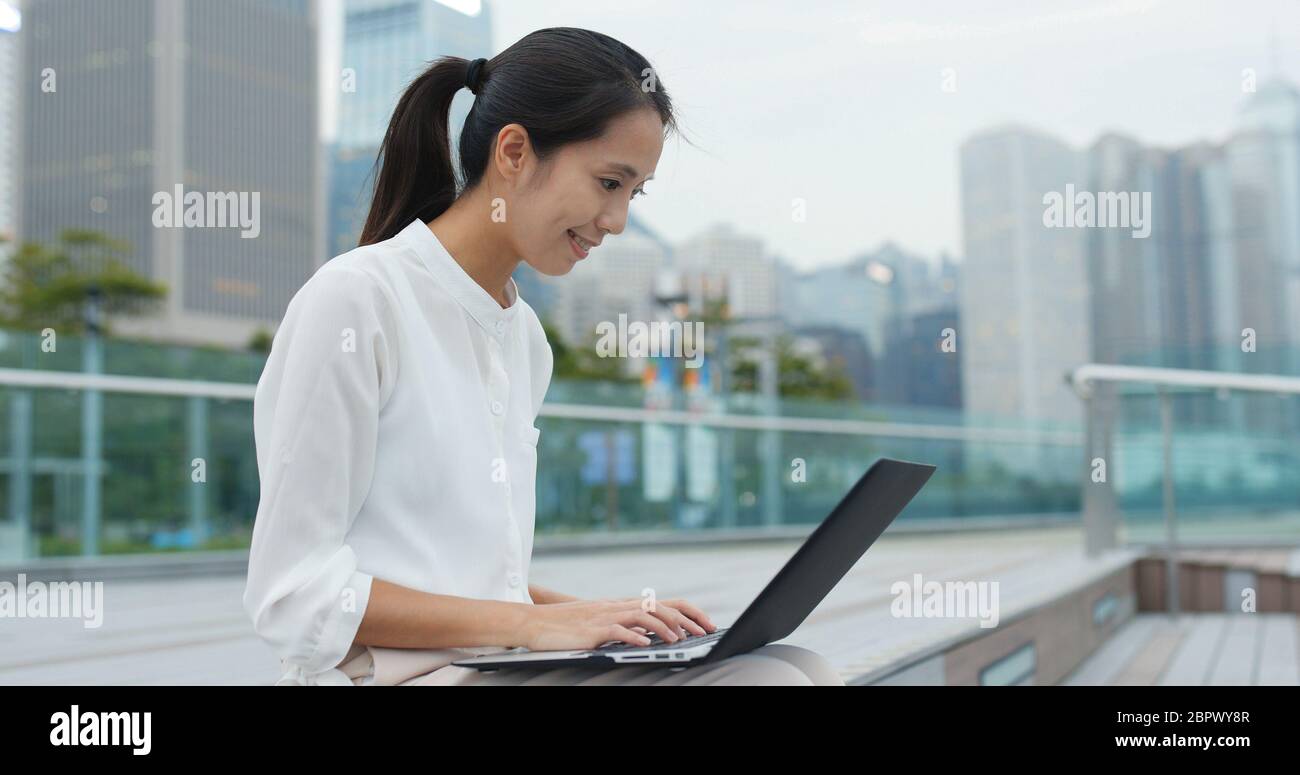 Young business woman work on laptop computer at park Stock Photo - Alamy