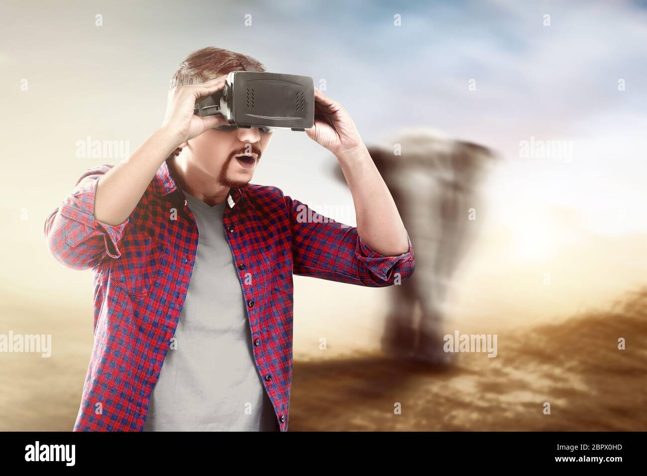 Asian man looking at blurry wild animals with virtual reality device. Augmented  reality technology Stock Photo - Alamy