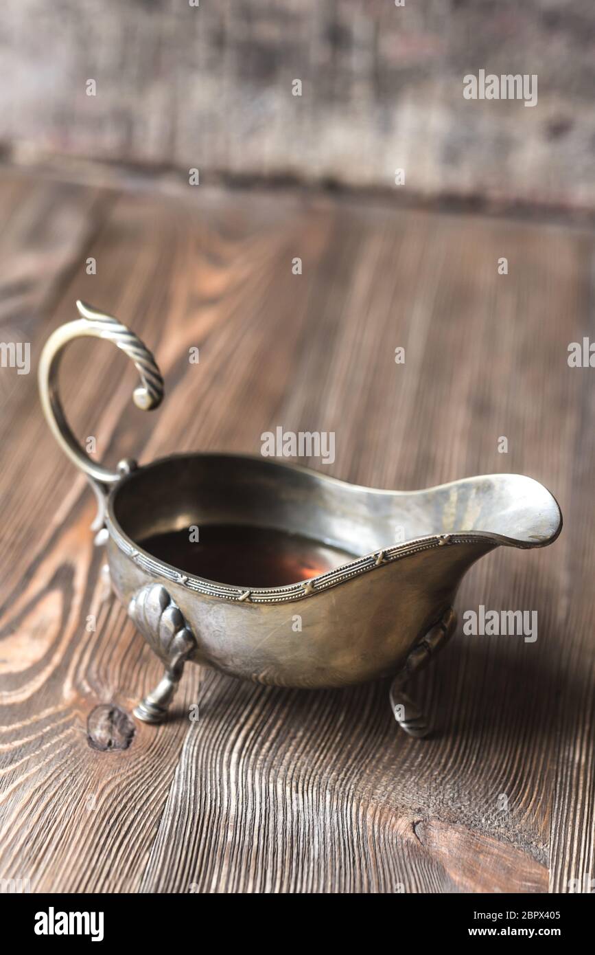 Maple syrup in vintage sauce boat Stock Photo