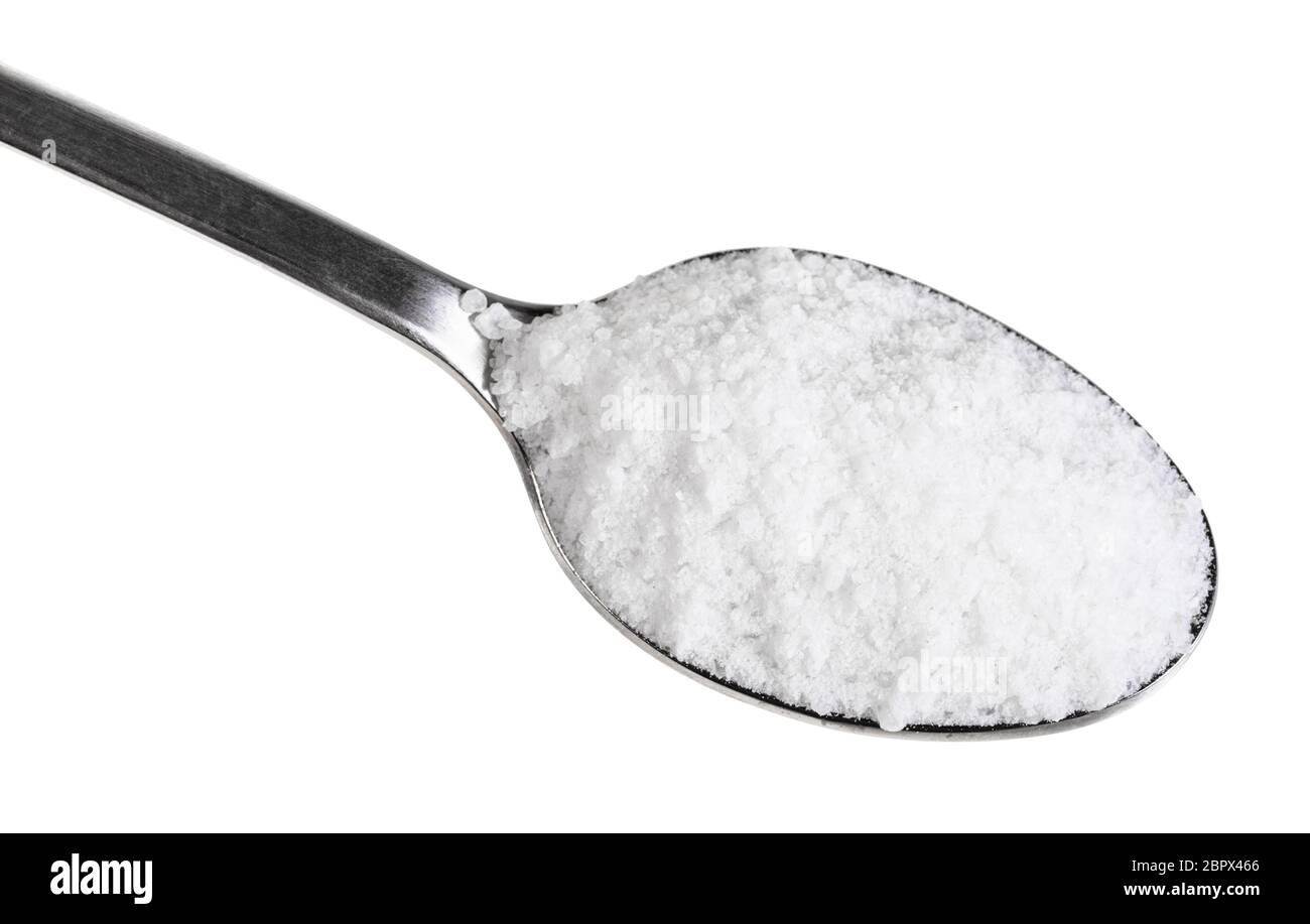 top view of teaspoon with grained Rock Salt close up isolated on white