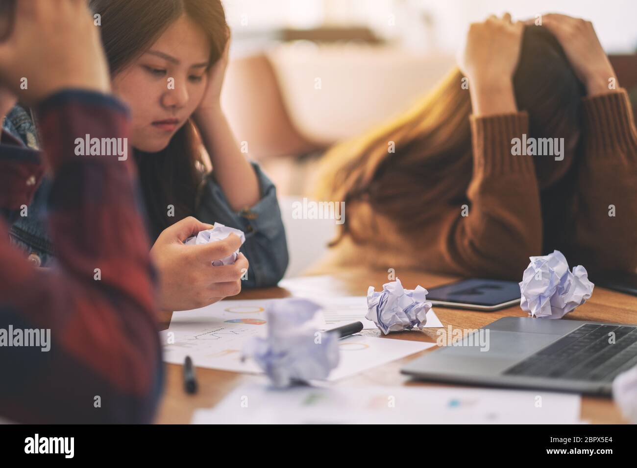Three businessman get stressed while having a problem in business meeting Stock Photo