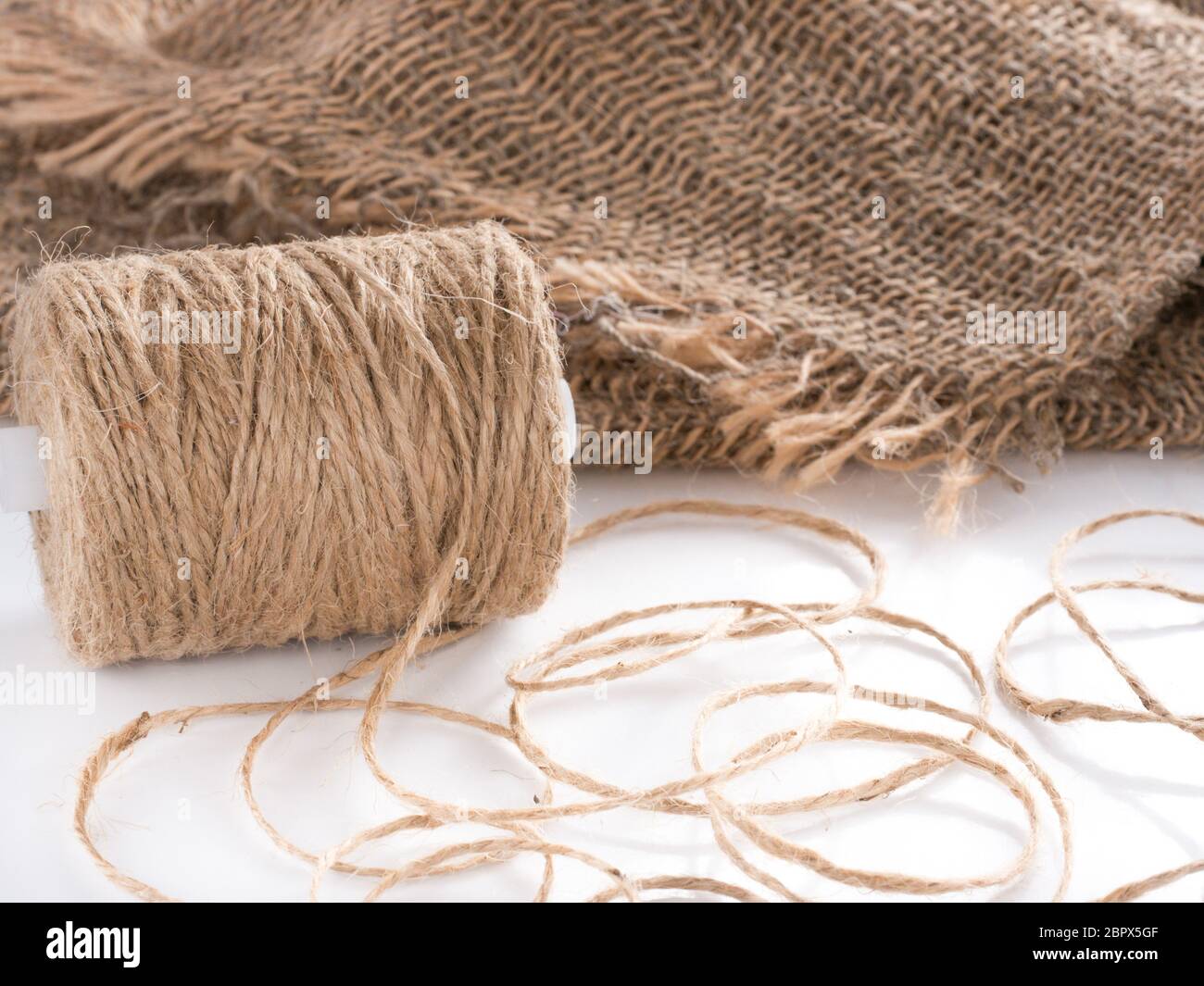 Skein of jute twine. Clew of natural rope. Roll of twine jute on
