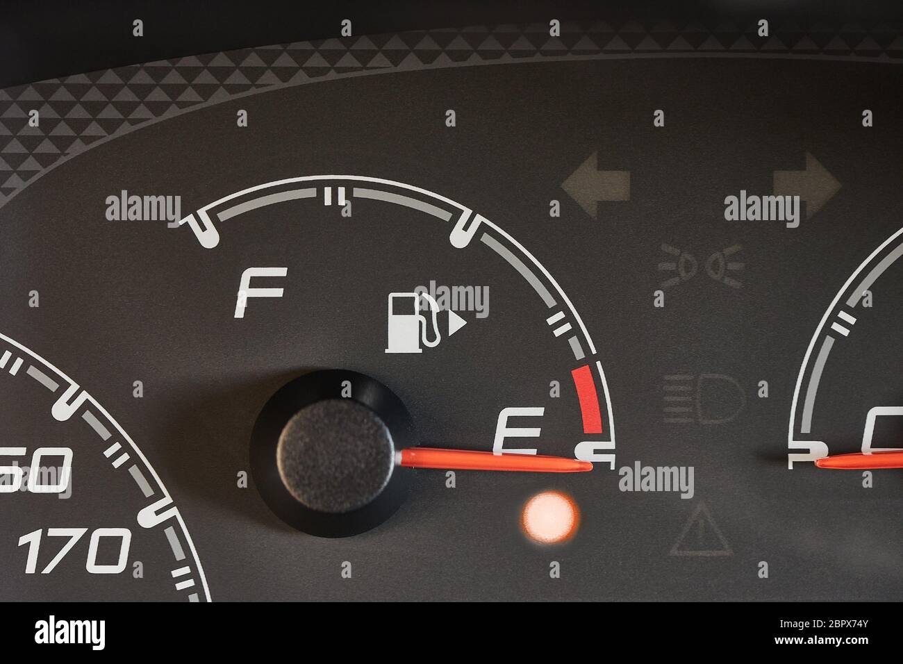 Fuel indicator of a car running out of fuel, warning light glowing