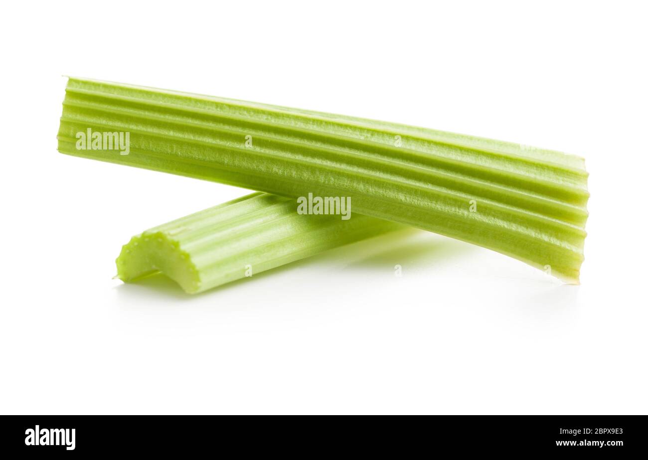 Celery sticks. Cutting celery stalks isolated on white background. Stock Photo