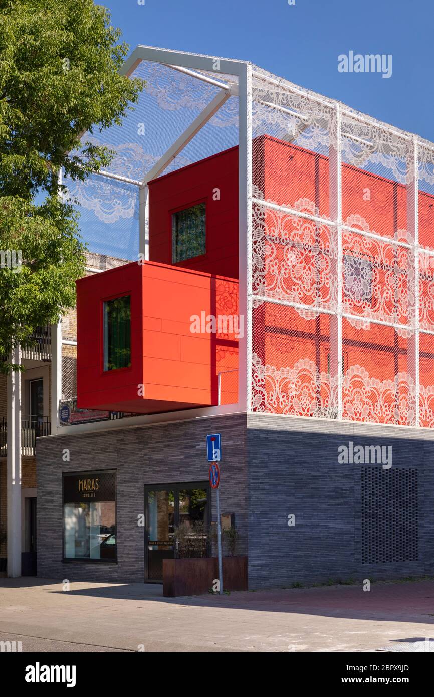 Eindhoven, The Netherlands, May 16th 2020. A building called MMXII by Bas  Termeer with bright red colored architecture and embroidery like details on  Stock Photo - Alamy
