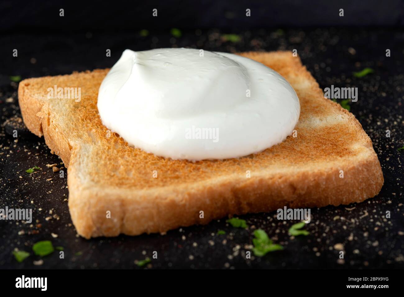 Toast with fresh cream and herbs Stock Photo