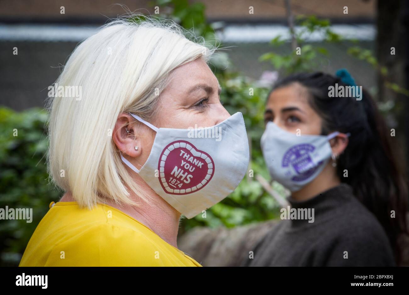 Claire McLachlan models a football team branded face mask designed by newly established Edinburgh pop-up company Breathe Easy which is producing a range of re-useable face coverings to help in the fight against COVID-19. Stock Photo