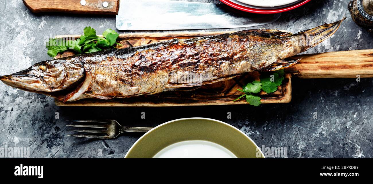 Baked grilled fish.Pike fish stuffed with mushrooms.Pike royally. Russian  cuisine Stock Photo - Alamy