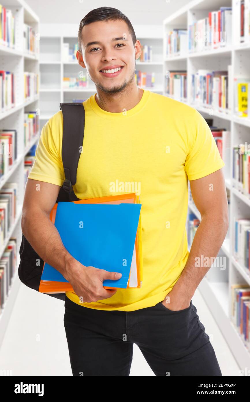 Student young man portrait format library learning smiling people learn Stock Photo