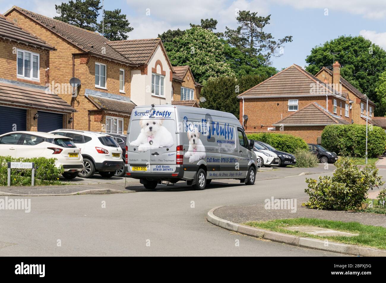 Scruffy to Fluffy, a mobile dog grooming business, outside a 1990's detached house, Wootton, Northampton, UK Stock Photo
