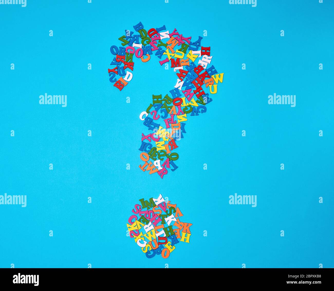 question mark figure from small multicolored wooden letters of the ...