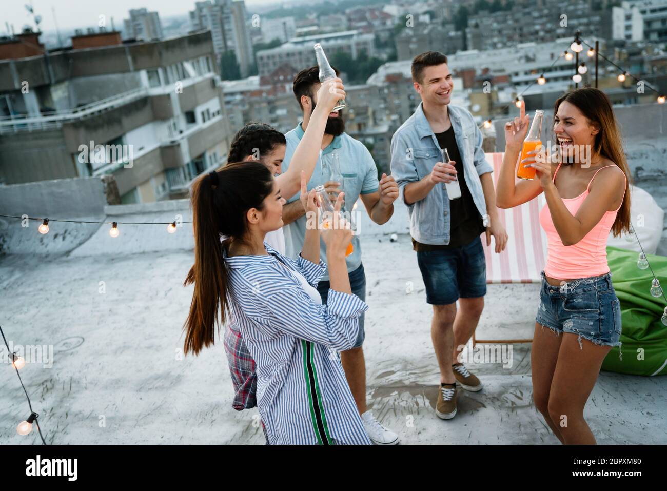 Group of young friends having fun togethert Stock Photo - Alamy