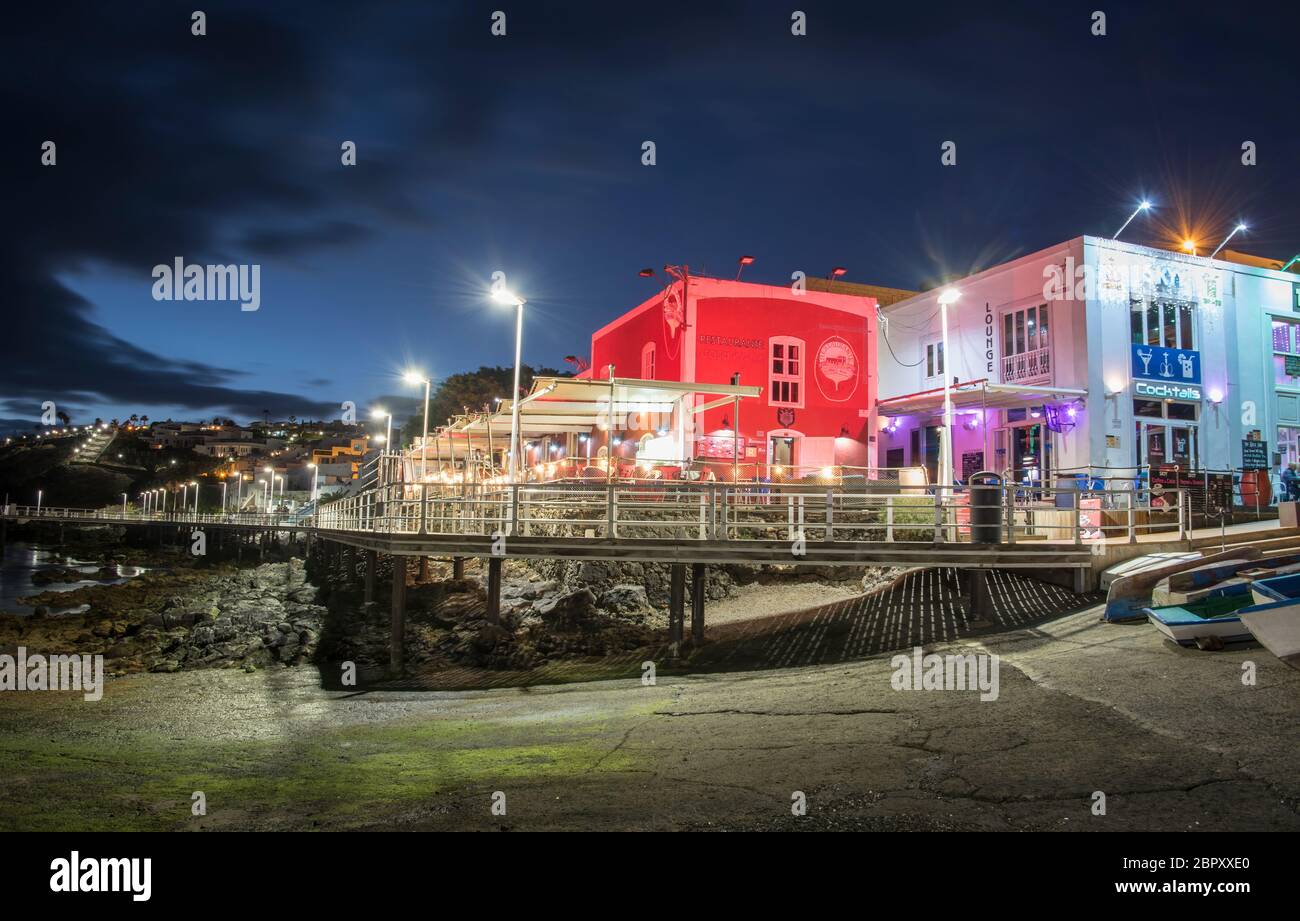 Harbour restaurants at night around in Puerto Del Carmen, Lanzarote, Canary Islands, Spain Stock Photo