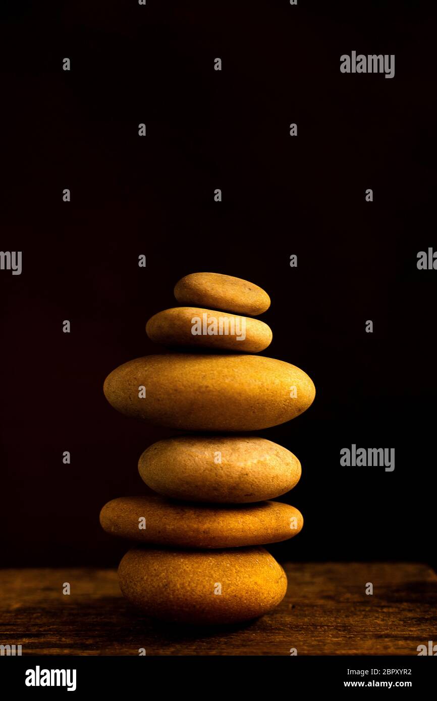 Pile of pebbles on a black background Stock Photo