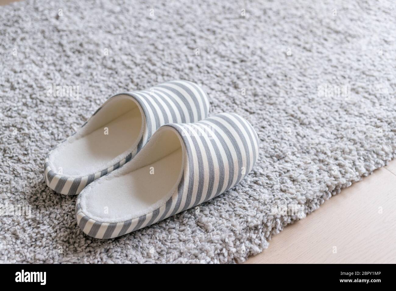 Slipper on the carpet Stock Photo Alamy