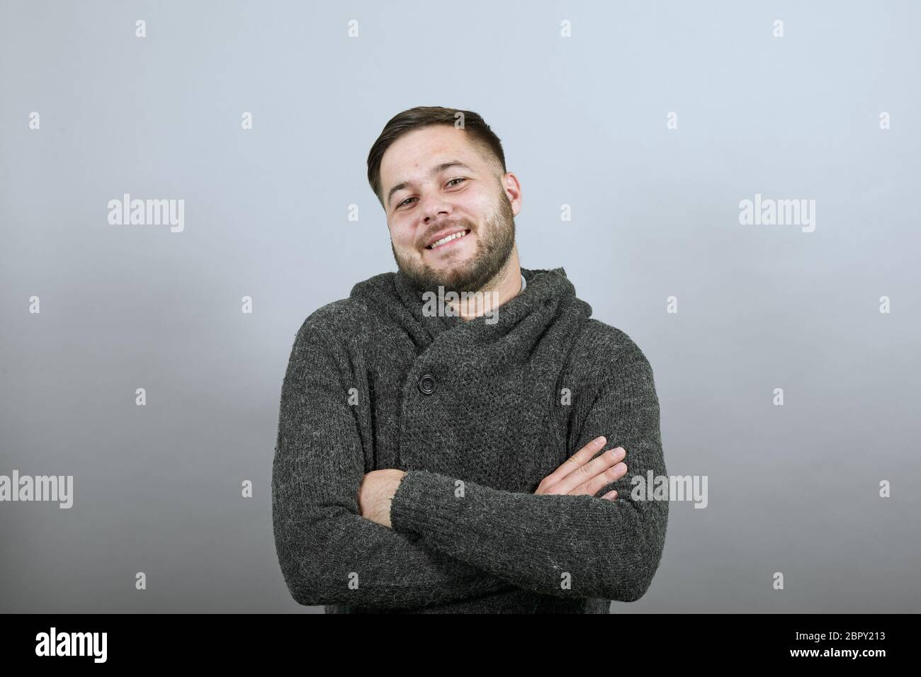 Happy Male Smiling, Holding Arms Crossed Over Chest. Peaceful And
