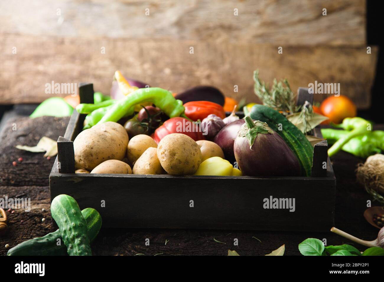 Vegetables on wood. Organic vegetables in rustic setting. Fresh food ...