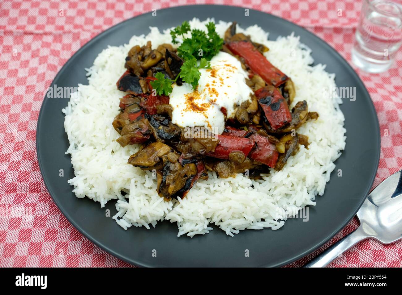 Vegetarian Mushroom and Red-Pepper Stroganoff served with Rice Stock Photo