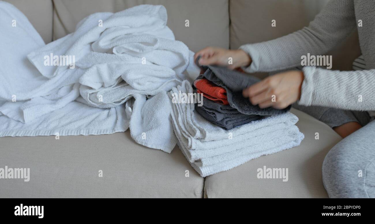 Folding laundry woman hands hires stock photography and images Alamy