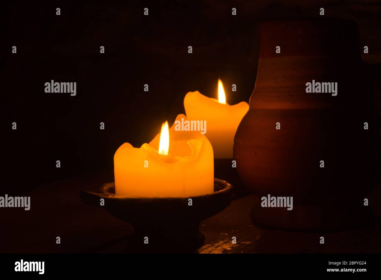 Burning candle in the dark Stock Photo Alamy