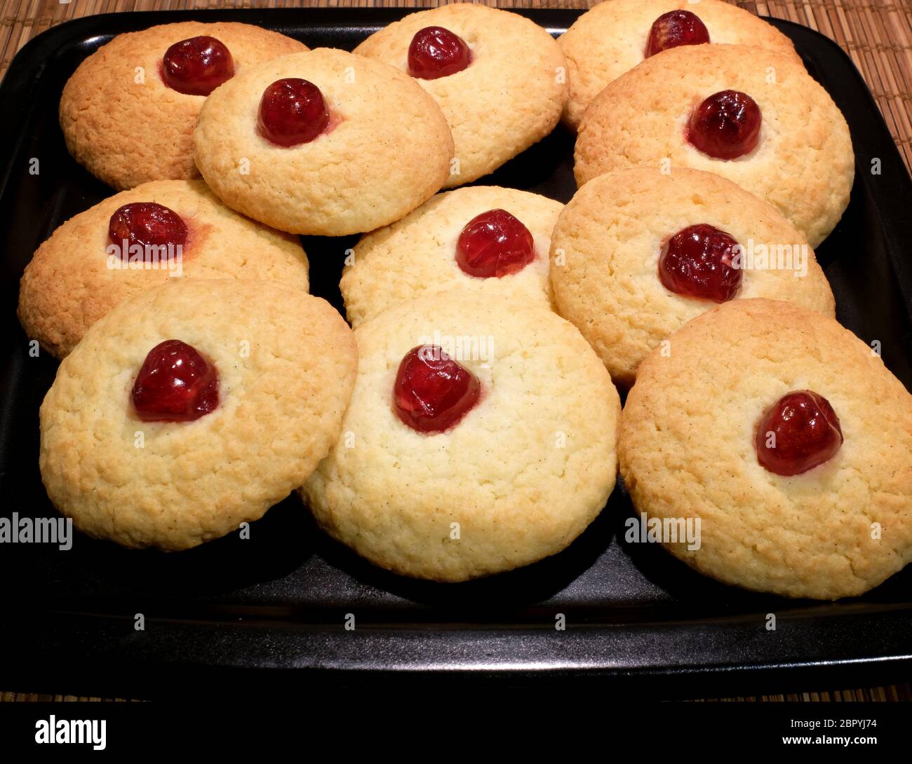 Home-baked Coconut and Cherry Cookies Stock Photo