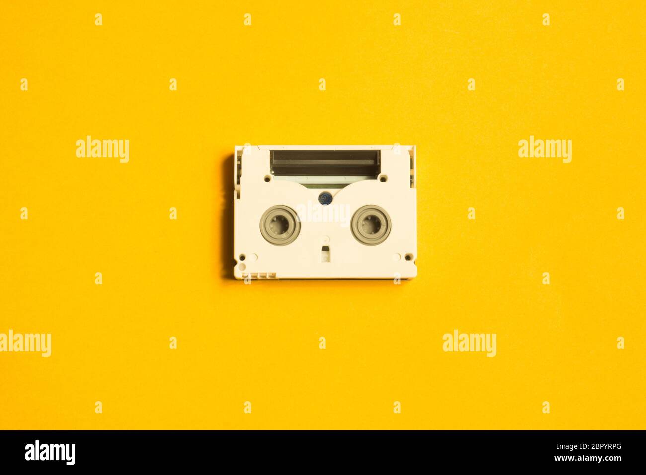 Download Digital Video Cassette On Yellow Background Mini Cassette Copy Space Stock Photo Alamy PSD Mockup Templates