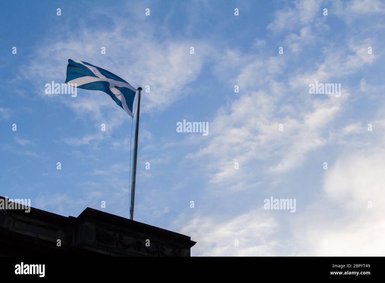 Scottish flag in the Scottish sky Stock Photo