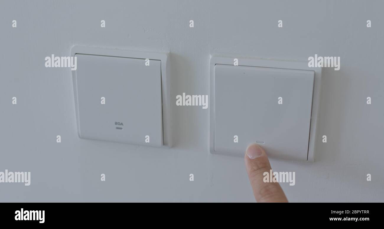 Human hand turn on a power button Stock Photo - Alamy