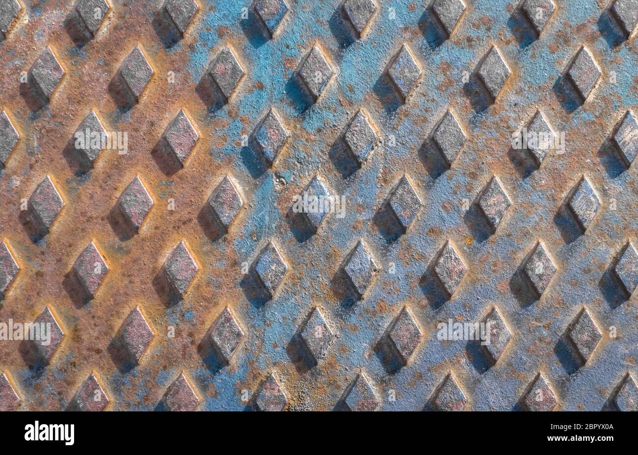 Old rusty drain cover background with diamond pattern Stock Photo Alamy
