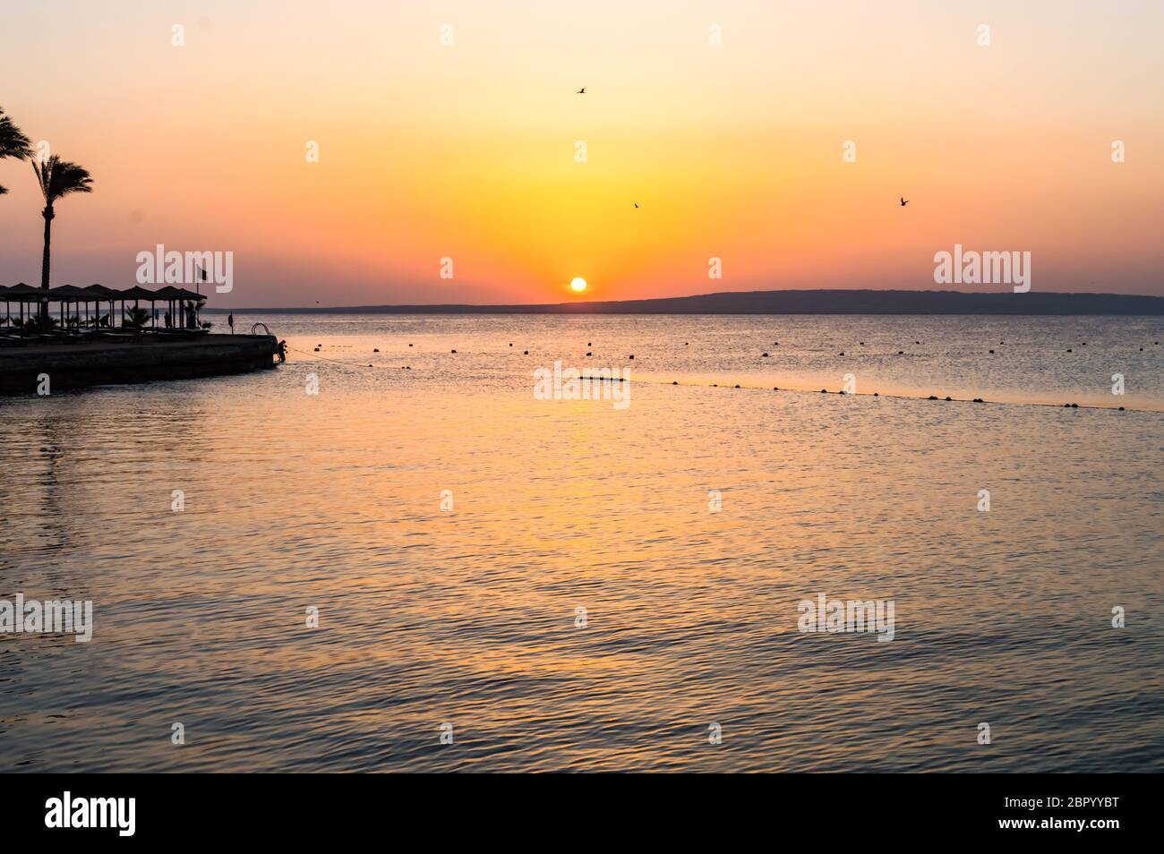 Sunrise over the Red Sea seen from a hotel Stock Photo - Alamy