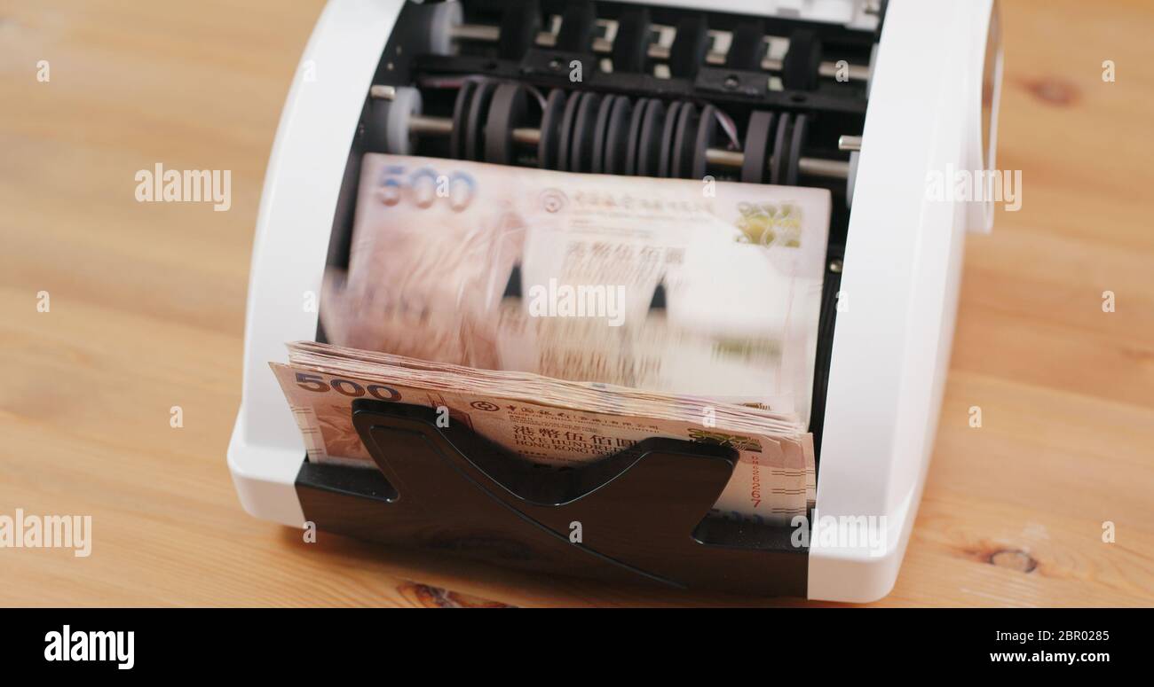 Money counting machine with Hong Kong dollar Stock Photo Alamy