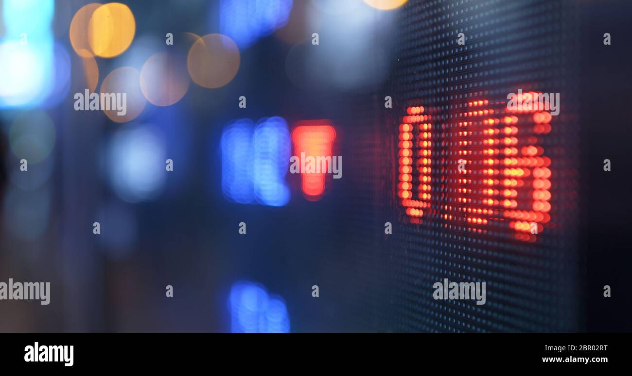Stock market display screen in the city at night Stock Photo - Alamy