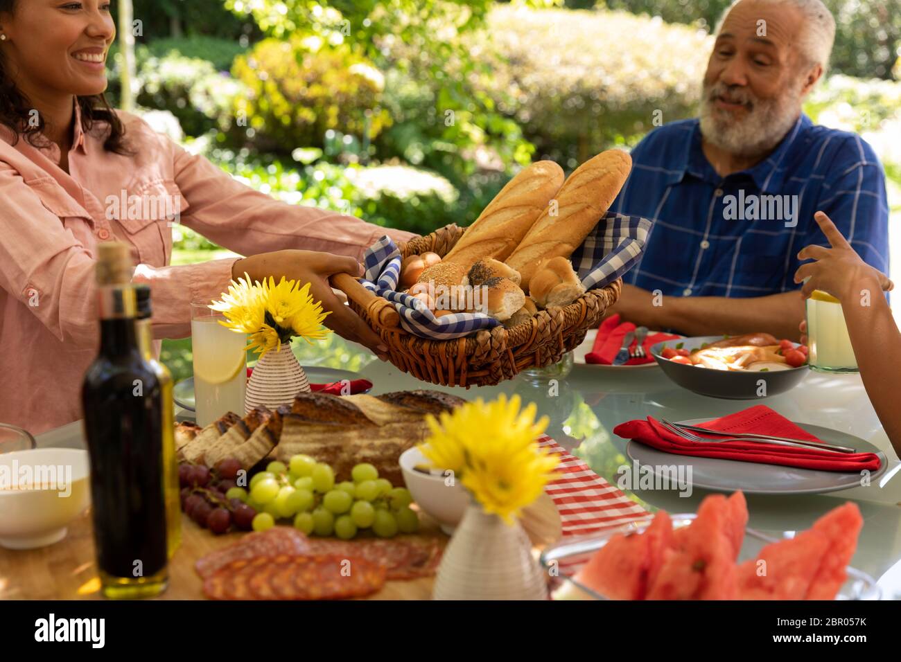 Family eating together at table Stock Photo